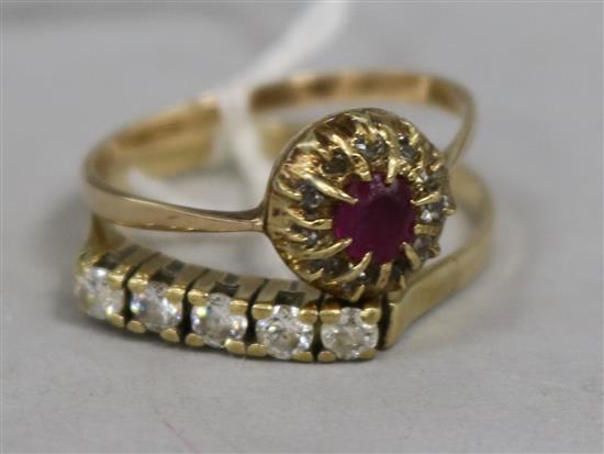 A ruby and diamond cluster ring and one other ring.